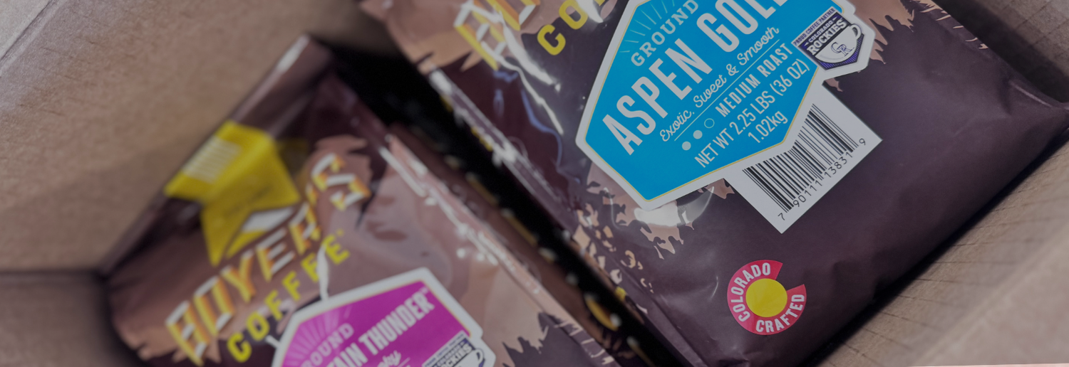 Close-up of a box with bags of coffee inside